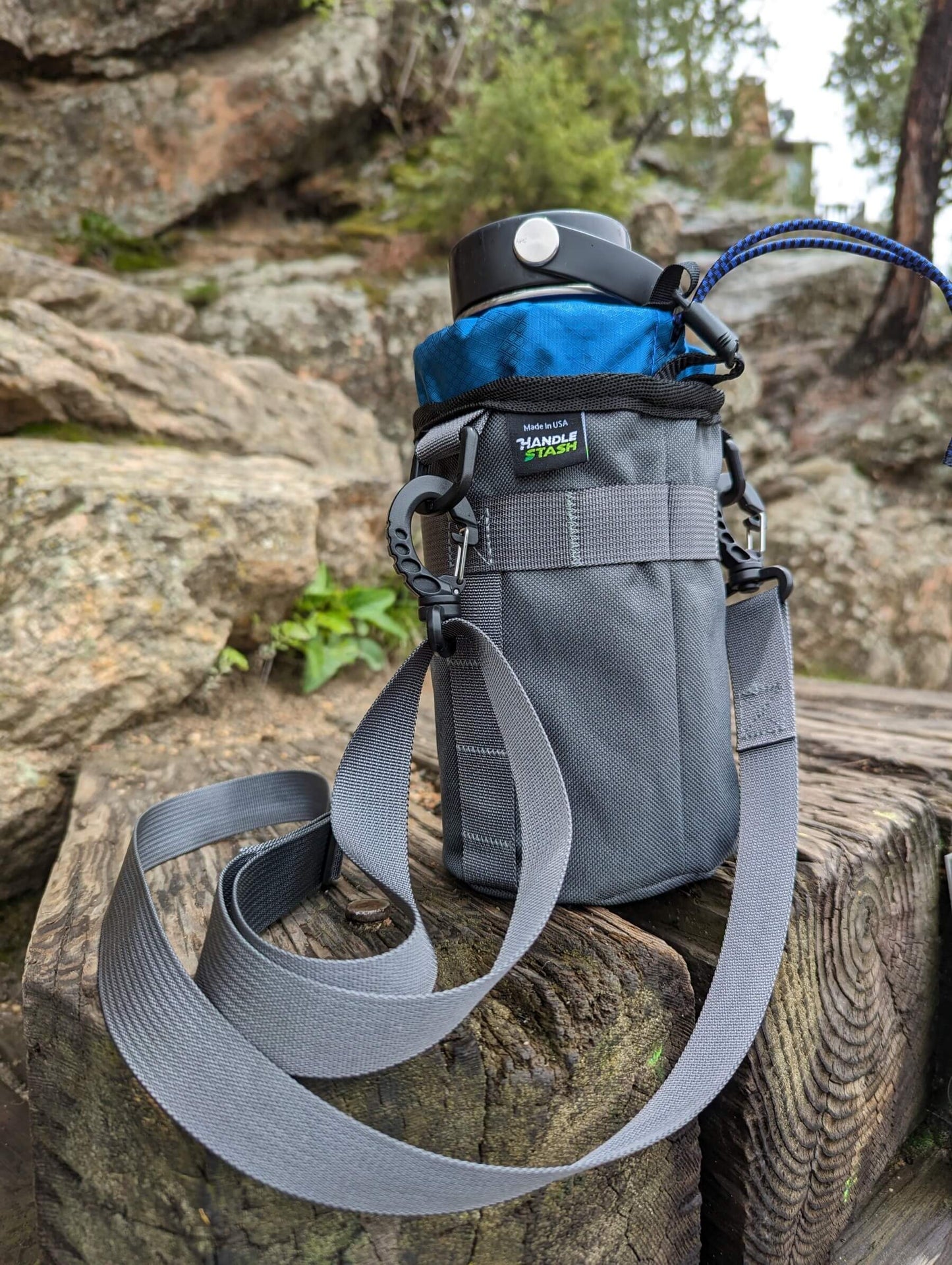 Water bottle sling or bike stem bag on rocks.