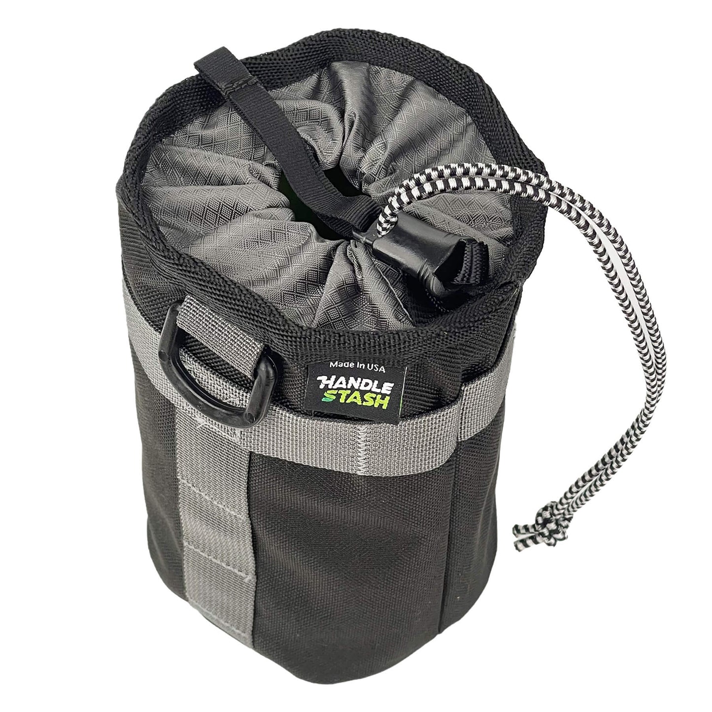 Black stem bag with grey liner cinched closed.