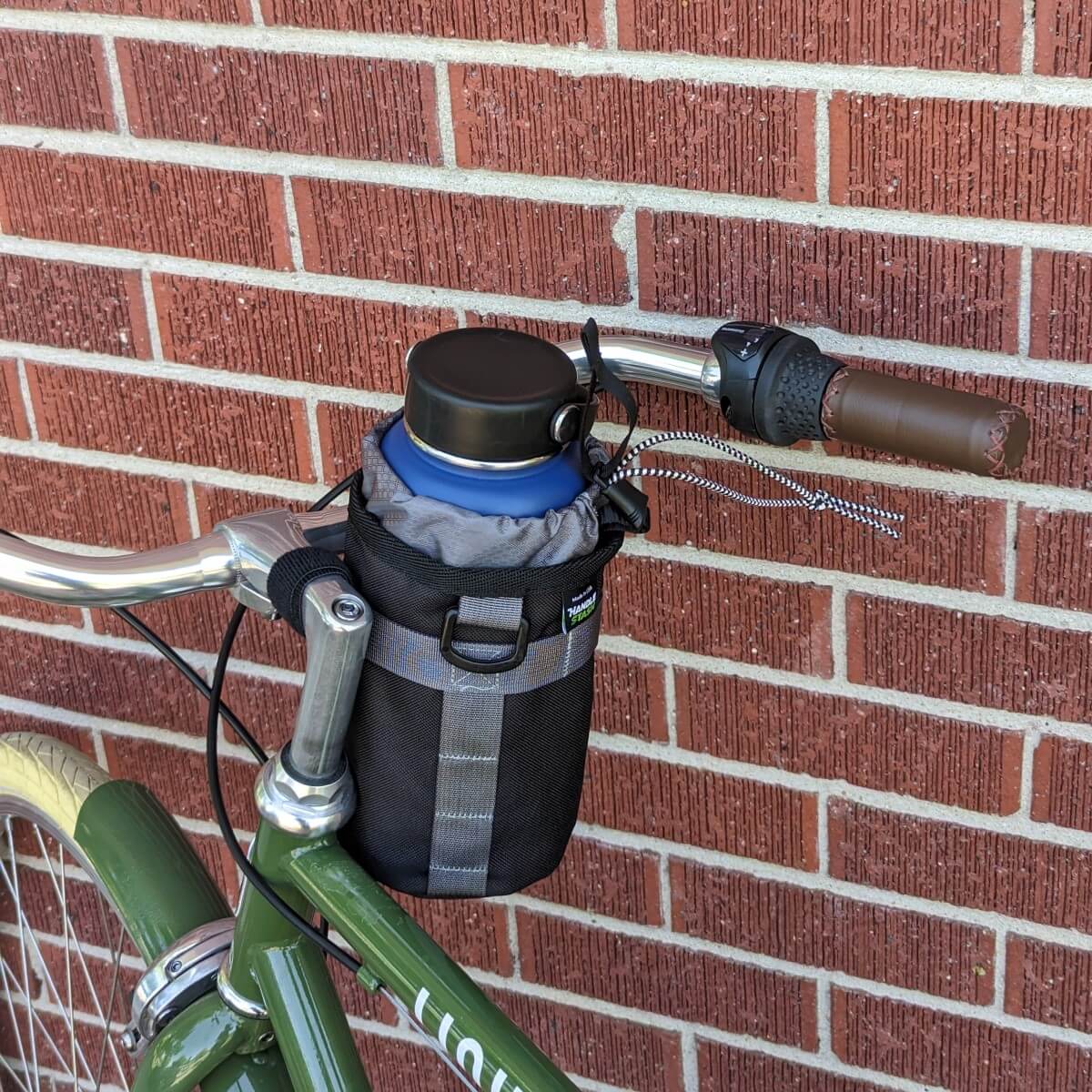 Black and grey stem handlebar bag on bike.