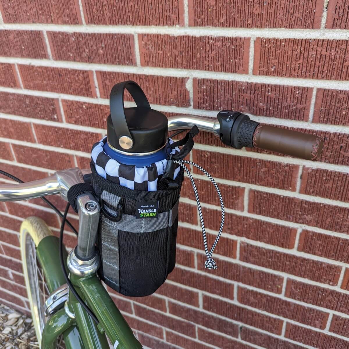 Two Tone and Black stem bag on bicycle handlebars.